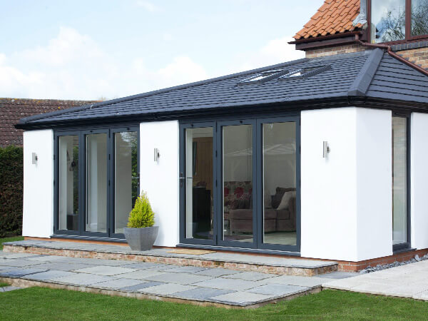 A solid roof extension with roof windows and bi-folding doors